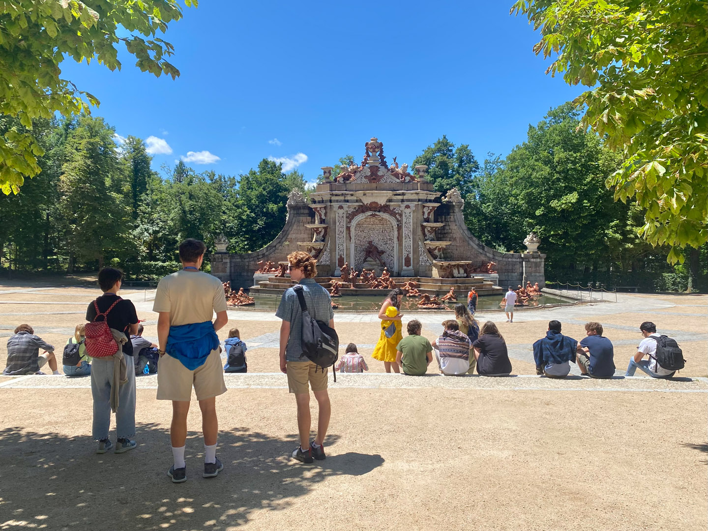 Near the end of the tour of the Royal Palace of La Granja de San Ildefonso, students rest in front of an ornate water feature. Photo by Zeke Lloyd ’24